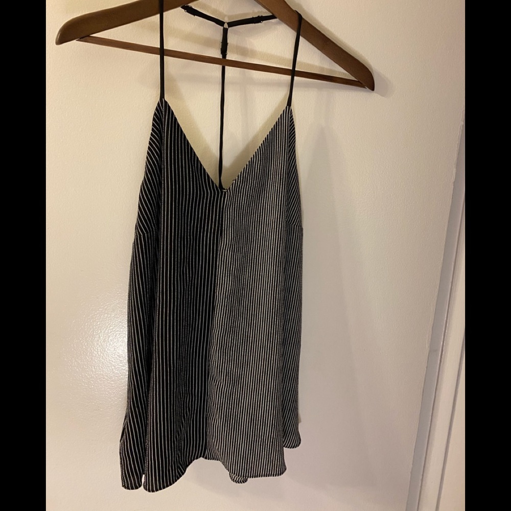 Black and white top with thin adjustable straps.